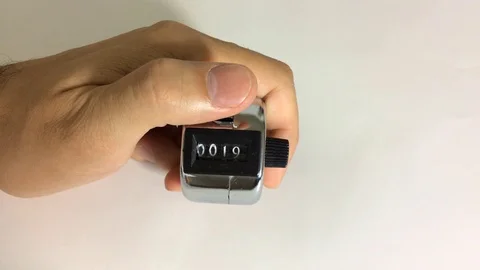 Hand down counting clicker machine Stock Footage 125724911