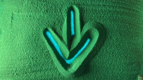 Hand drawing the arrow to down in the Green Sand. Stock Footage 233506893