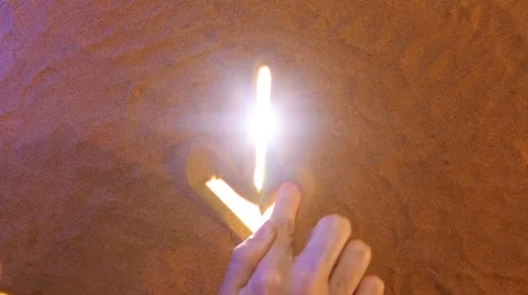 Hand drawing Arrow symbol in the sand. Beach background. Top view 스톡 동영상 61587466