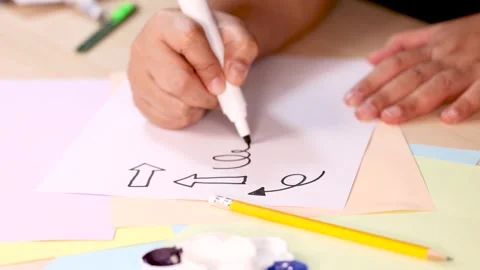 Hand Drawing Arrows and Doodles with Black Marker on Paper 库存影片 321663934
