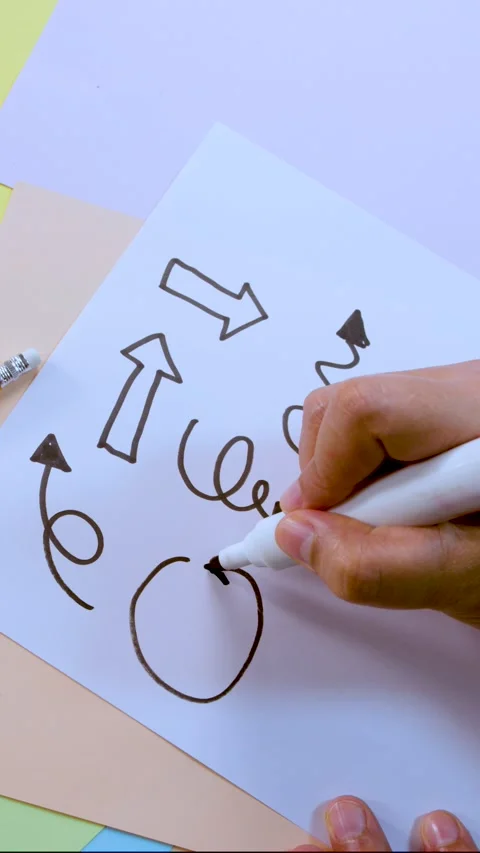 Hand Drawing Arrows and Shapes on White Paper with Marker Stock Footage 318434773