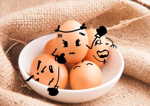 Hand drawing emotion on eggs Stock Photos