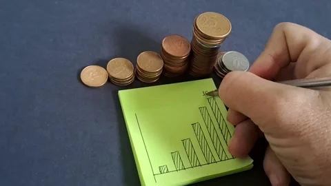 Hand drawing financial growth chart with coins Stock Footage 345448491