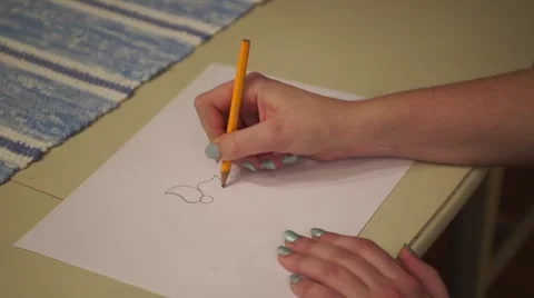 A hand drawing a flower. Stock Footage 44800697