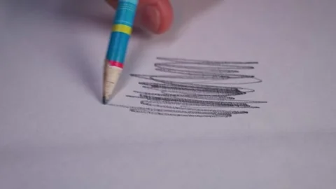 Hand Drawing Graphite Lines with Blue Pencil on White Paper Surface Stock Footage 339365481