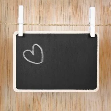 Hand drawing heart on blackboard Stock Photos