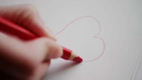 Hand drawing heart contour by red pencil for Valentine's day Stock Footage 101288013