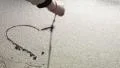 A hand drawing a heart on the sand HD Footage