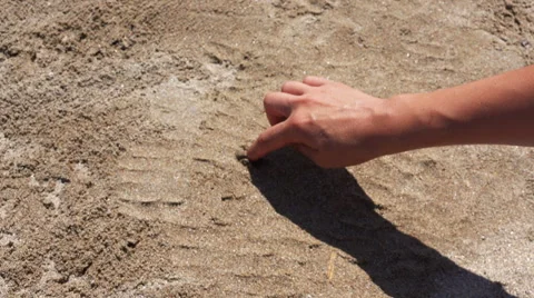 Hand drawing a heart on sand Stock Footage 41421116