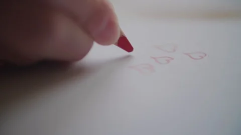 Hand drawing many hearts by red pencil on Valentine's day Stock Footage 101301861
