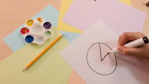Hand Drawing Math Pie Chart on Paper From Above Stock Footage 322557134