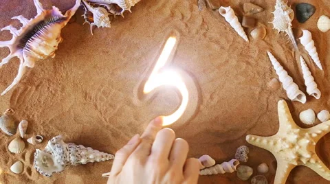 Hand drawing Number Five 5 symbol in the sand. Beach background. Top view Stock Footage 61586780