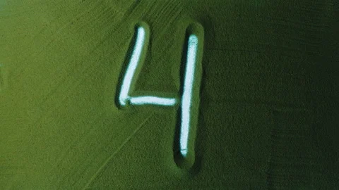 Hand drawing Number Four 4 Symbol in the Green Sand. Video stock 209933885