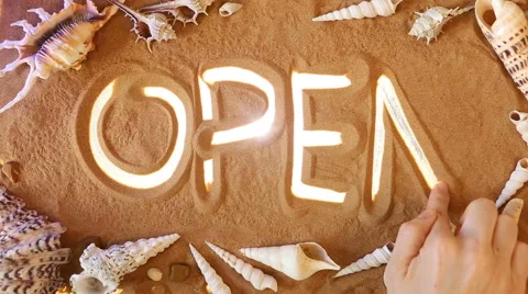 Hand drawing Open symbol in the sand. Beach background. Top view Stock Footage 61891316