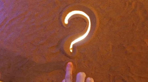 Hand drawing Question mark symbol in the sand. Beach background. Top view Stock Footage 61587208