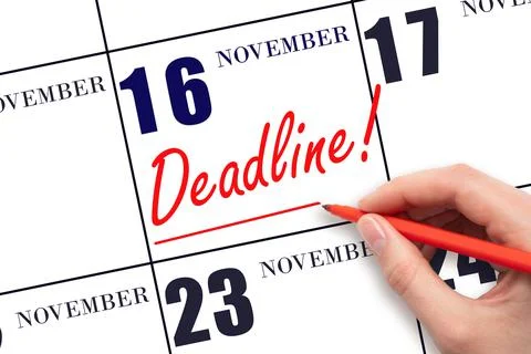 Hand drawing red line and writing the text Deadline on calendar date November Stock Photos