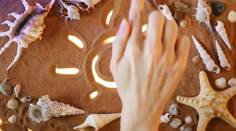 Hand drawing Sun symbol in the sand. Beach background. Top view Stock-Footage 61587291