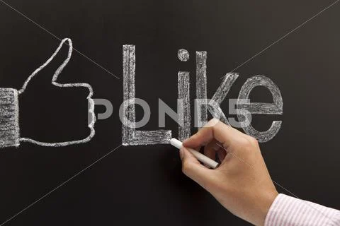 Hand drawing a thumbs up sign Stock Photos