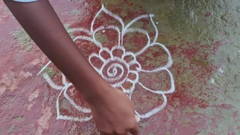 Hand Drawing Traditional Kolam Pattern on Floor in Karnataka Stock Footage 324867631