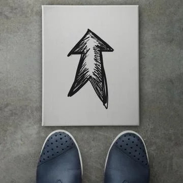Hand drawn arrow design doodle on front of business man feet as concept Stock Illustration