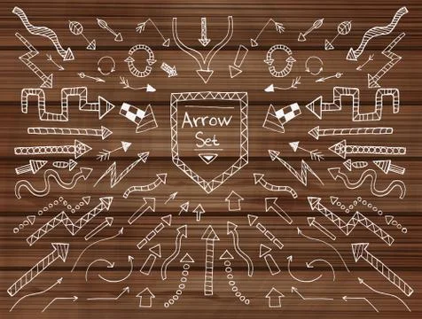 Hand drawn arrow icons set on wooden texture Illustrazione stock