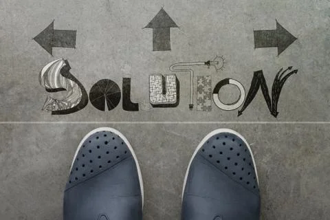 Hand drawn business solution design word on front of business man feet as con Stock Illustration