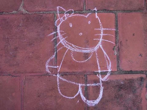 Hand drawn cute doll. Using color chalk pieces. Stock Photos