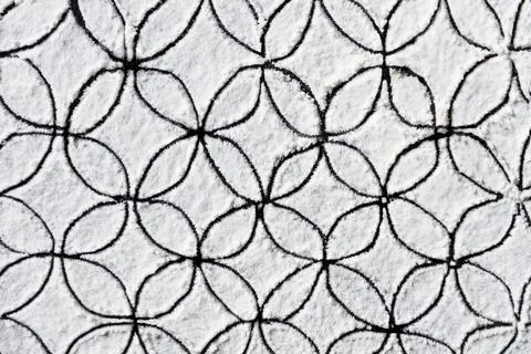 Hand drawn geometric pattern ornament printed on white flour, sand, powder. B 스톡 사진