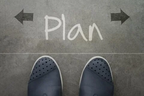 Hand drawn plan design word on front of business man feet as concept イラスト素材