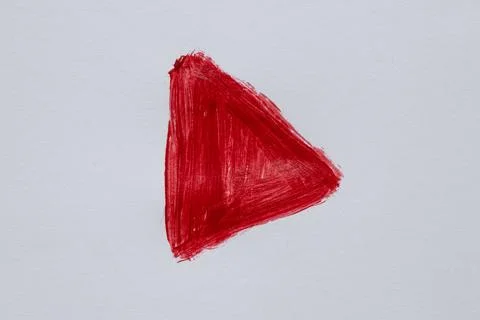 Hand drawn red play button symbol with brush on white Stock Photos