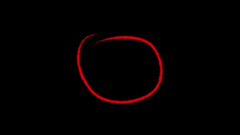 Hand drawn red scribble circle shape isolated on a plain black background f.. Stock Footage 333782804