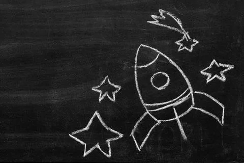 Hand-drawn rocket, cosmonaut, comet, stars, infinite space. chalkboard Stock Photos