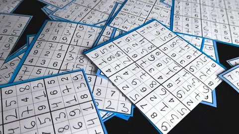 Hand drawn solved sudoku puzzles gliding on black background Stock Footage 340142457