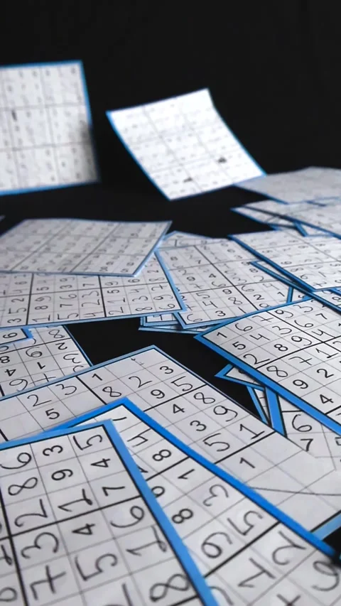 Hand drawn sudoku puzzles scattering over a black background Stock Footage 340552641