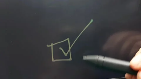 Hand draws a box and makes a checkmark in it Stock Footage 284444499