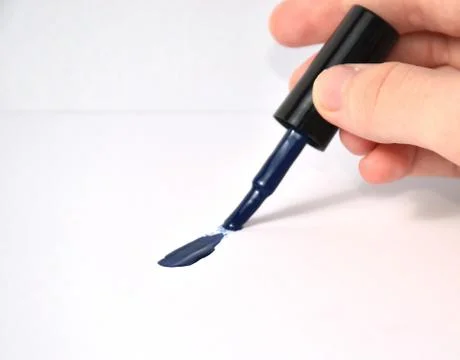 Hand draws with a brush on  Stock Photos