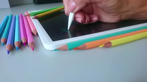 Hand draws a pattern on the graphic tablet Stock Footage 201205157