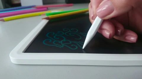 Hand draws a pattern on the graphic tablet	 Stock Footage 222786303