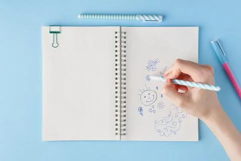 Hand draws scribble in a notebook. Blank notepad page in bullet journal Stock Photos
