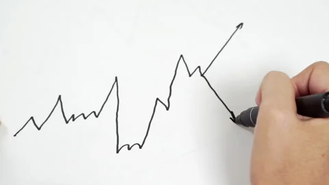Hand draws a stock chart on a sheet of paper Video stock 158576843