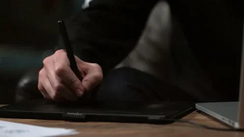 The hand draws on the tablet Stock Footage 147554236