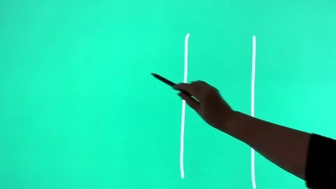 Hand draws on the touchpad tic-tac-toe in the shape of hearts and arrows Stock Footage 169605682