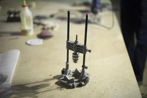 Hand drill on table. Tools in garage. Hole drilling tool. Stock Photos