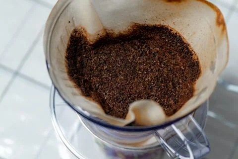 Hand drip coffee filter with uses coffee grounds Stock Photos