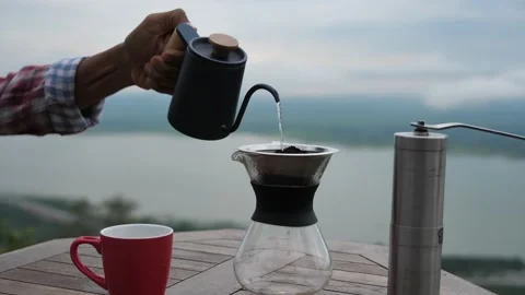 Hand drip coffee,Tourists with drip coffee Stock Footage 140761987