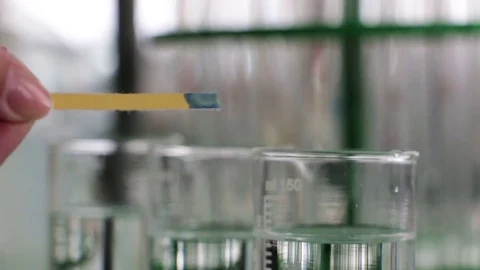 Hand dripping pH indicator Video stock 75913369