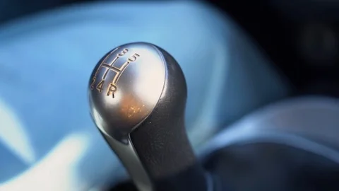 Hand of driver man shifting manual gear in a car close up. Guy switch gears Stock Footage 127790284