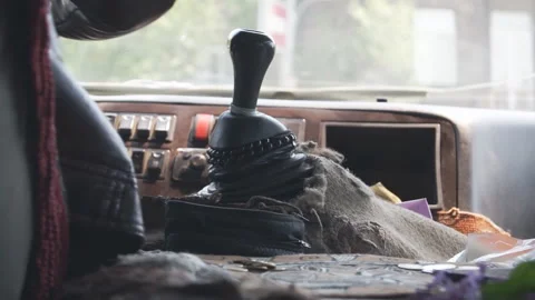 The hand of the driver of a public bus changes gears with a lever in the process Stock Footage 188893719