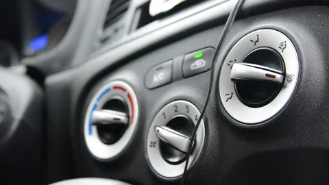 Hand driver turn control button of air condition system in car. Stock-Footage 123100655