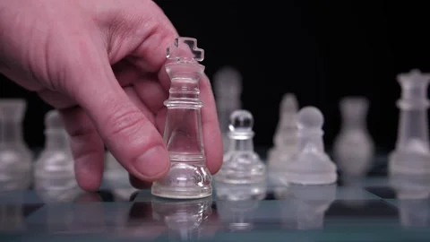 Hand dropping chess king resign lost game slow motion Stock Footage 150457591